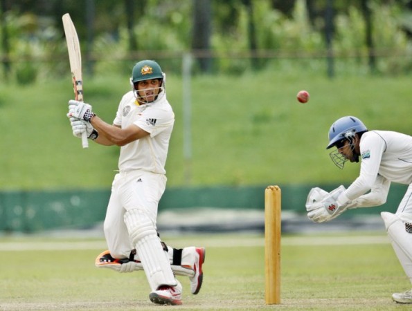 Usman Khawaja cuts at the gully region