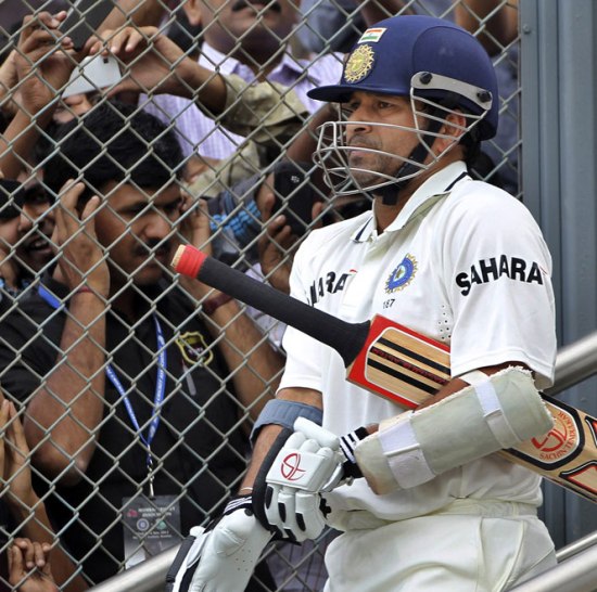 Sachin Tendulkar walks out the middle