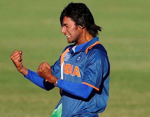 Kamal Passi celebrates after taking a wicket